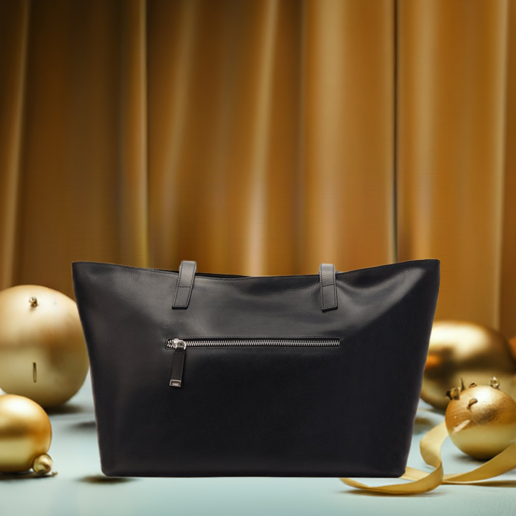  A spacious black leather tote bag, showcasing a sleek design ideal for carrying essentials in style.