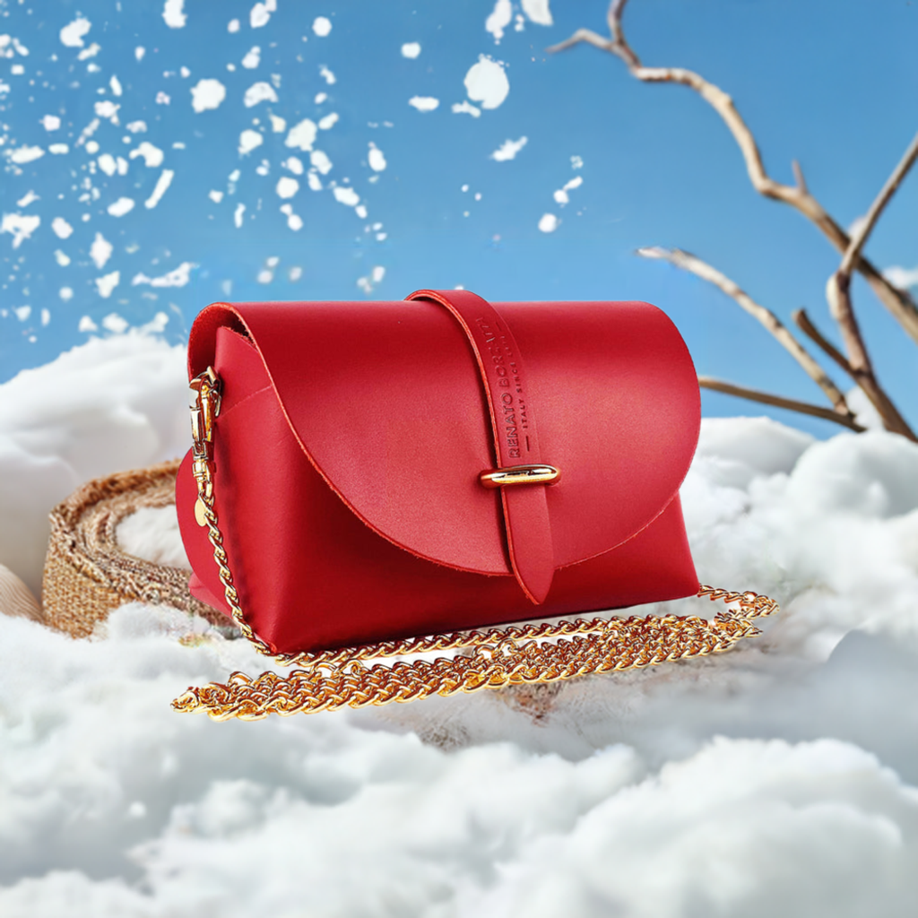 A red leather crossbody bag featuring a stylish gold chain for an elegant touch.