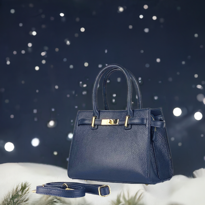 A blue leather handbag featuring elegant gold hardware, showcasing a stylish and sophisticated design.