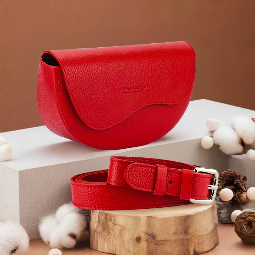 A red leather purse and matching belt featuring a stylish buckle, elegantly displayed on a neutral background.